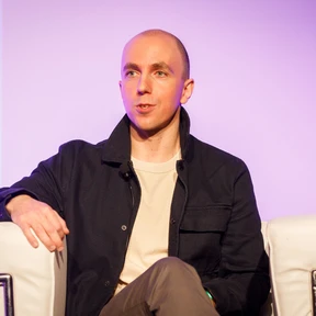 Eugene Kuznetsov speaking at a tech event